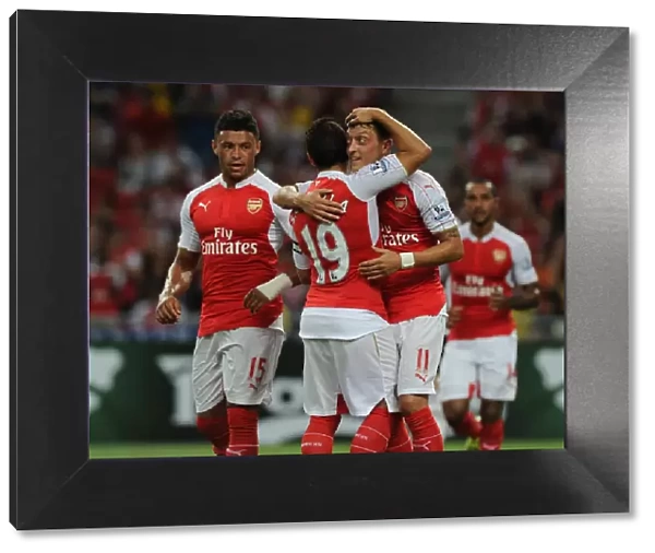 Arsenal's Ozil, Oxlade-Chamberlain, and Cazorla Celebrate Goals Against Everton in 2015-16 Asia Trophy