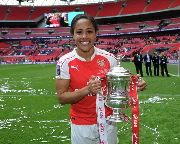Arsenal Ladies Celebrate FA Cup Victory: Alex Scott Lifts the Trophy Over Chelsea Ladies at Wembley Stadium