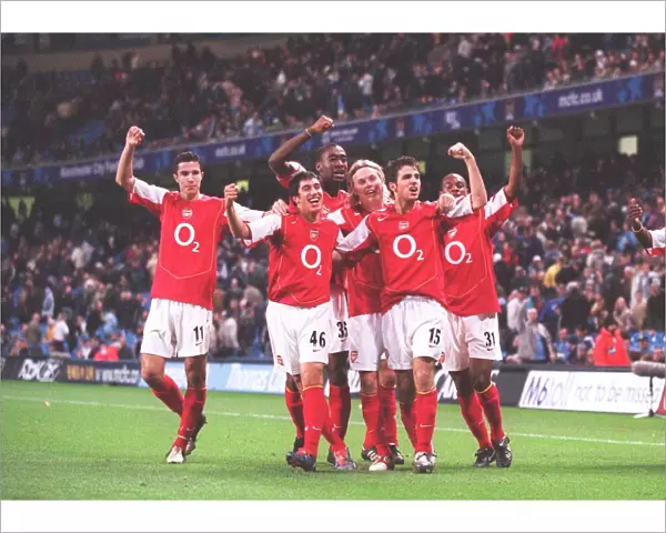 The Arsenal players celebrate the 2nd goal scored by Danny Karbassiyoon