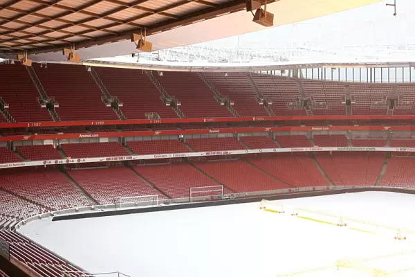 Winter's Embrace: Arsenal's Emirates Stadium in Snow