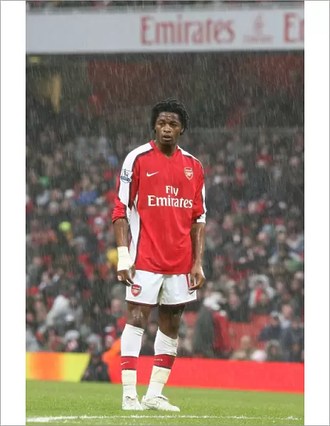 Alex Song (Arsenal) stands in the rain