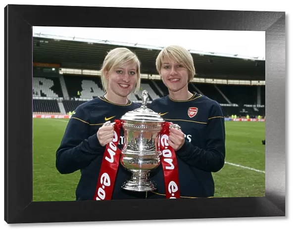 Arsenal Ladies physios with the FA Cup Trophy