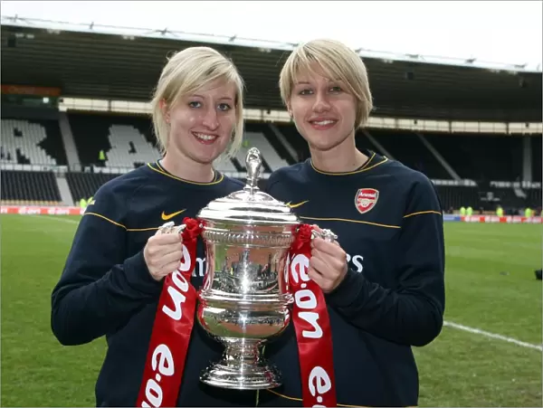 Arsenal Ladies physios with the FA Cup Trophy