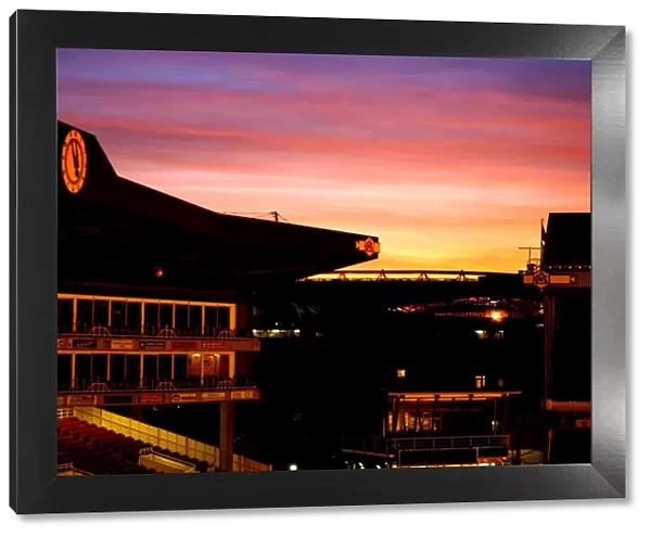 The Sun sets over The Arsenal and Emirates stadiums