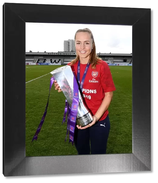 Arsenal Women's Football Team: Celebrating WSL Title Victory with Lia Walti and the Trophy