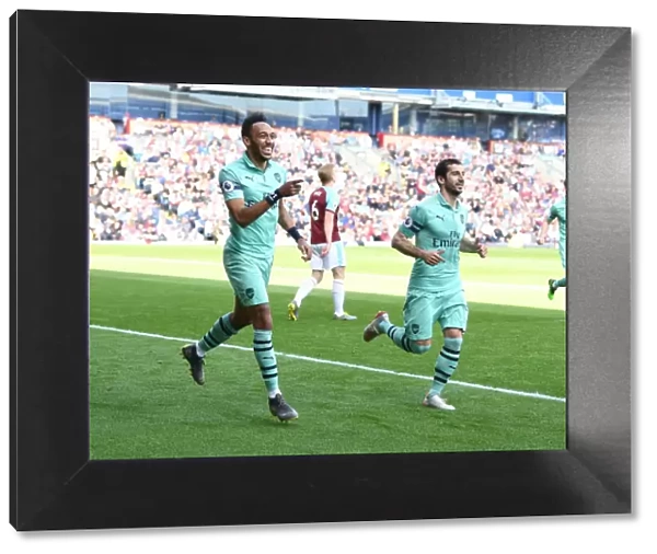 Arsenal's Aubameyang and Mkhitaryan: A Dynamic Duo Celebrates Their Goal Against Burnley (2018-19)