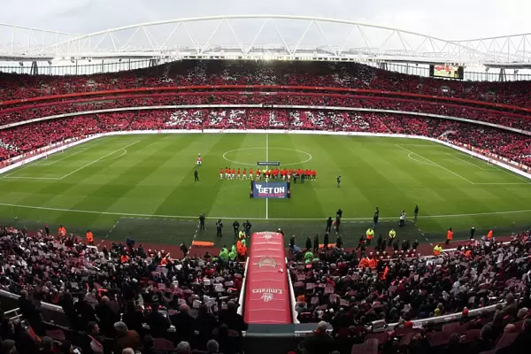 Arsenal and Manchester United shakes hands as the fans hold up Lace Up Save Lives cards