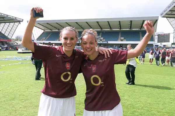 Lianne Sanderson and Julie Fleeting (Arsenal) with the FA Cup Trophy