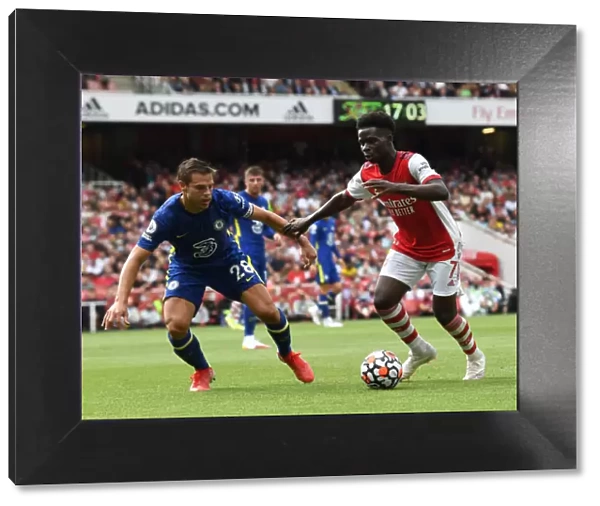 Arsenal's Bukayo Saka Clashes with Chelsea's Cesar Azpilicueta in the 2021-22 Premier League Match