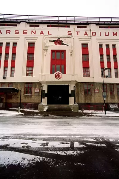 Winter's Embrace: Arsenal Stadium in Snowy Highbury, London