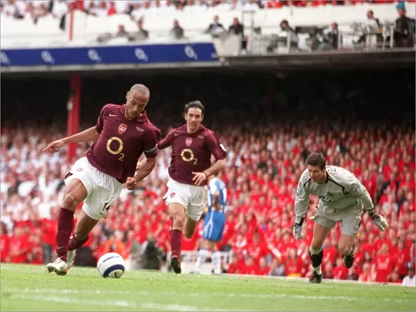 Thierry Henry scores Arsenals 3rd goal his 2nd past Mike Pollitt (Wigan)