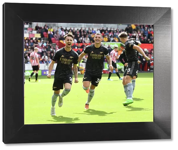 Arsenal's Vieira and Xhaka Celebrate Their Roles in Scoring the Third Goal Against Brentford (2022-23)