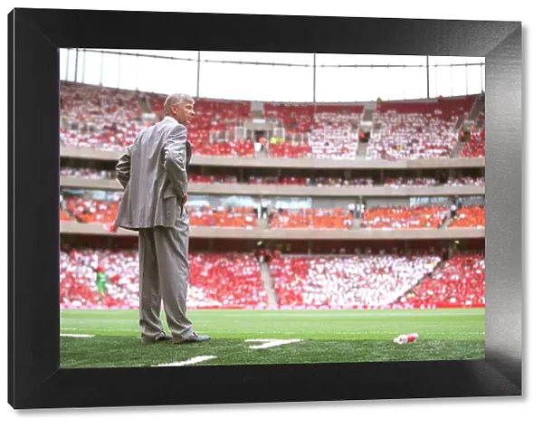 Arsene Wenger the Arsenal Manager at the edge of his technical area