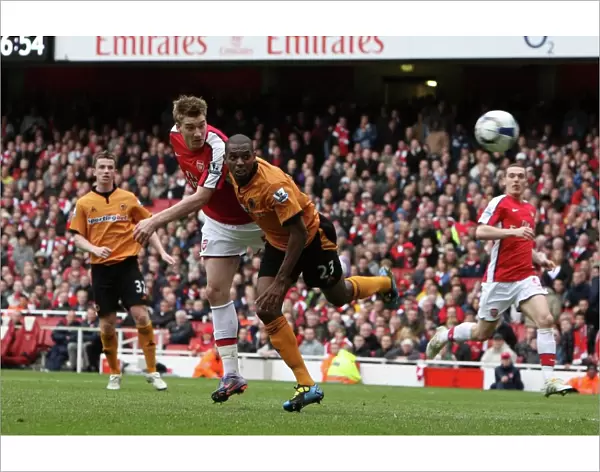 Nicklas Bendtner scores Arsenals goal under pressure from Ronald Zubar (Wolves)