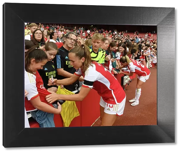 Arsenal's Lia Walti Greets Fans with Autographs After Arsenal Women's Victory Over Liverpool