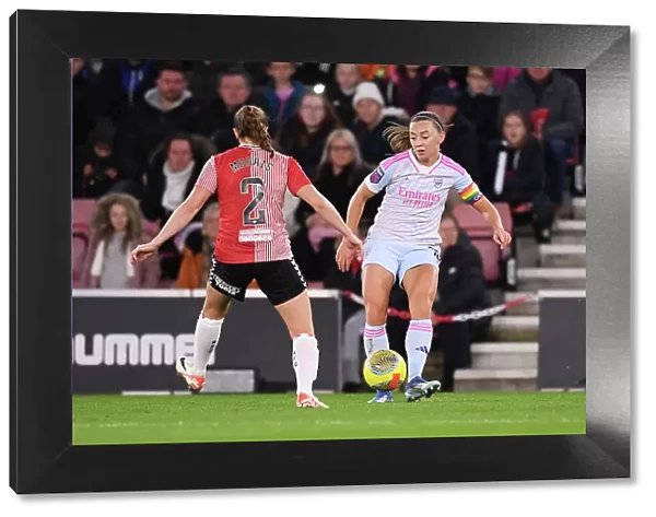 Conti Cup Clash: Arsenal Women vs Southampton Women at St. Mary's Stadium - Katie McCabe Fends Off Pressure