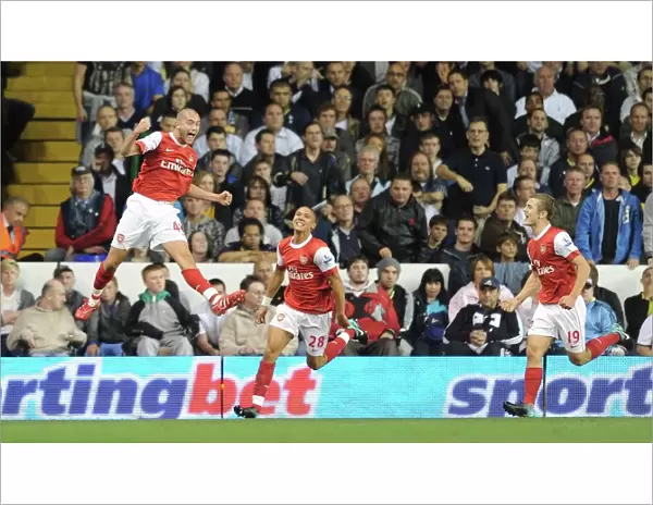 Henri Lansbury celebrates scoring the 1st Arsenal goal with Kieran Gibbs