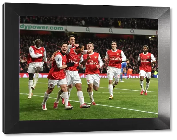 Theo Walcott celebrates scoring Arsenals 3rd goal with his team mates