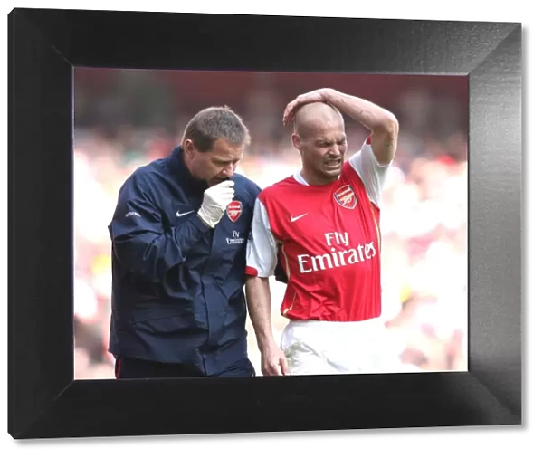 Arsenal's Gary Lewin Tends to Freddie Ljungberg: 2:1 Win Against Bolton Wanderers, 2007