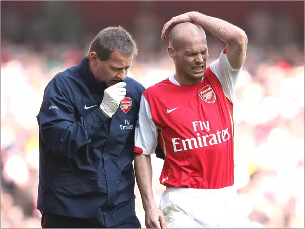 Arsenal's Gary Lewin Tends to Freddie Ljungberg: 2:1 Win Against Bolton Wanderers, 2007