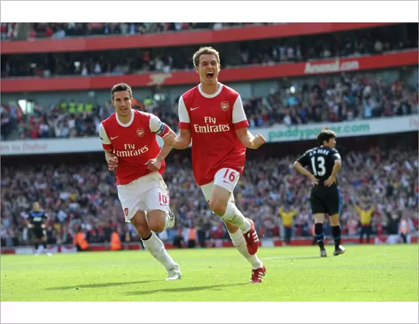 Aaron Ramsey celebrates scoring Arsenals goal with Robin van Persie