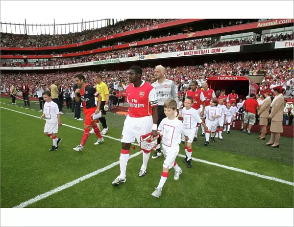 Kolo Toure (Arsenal) leads out the team
