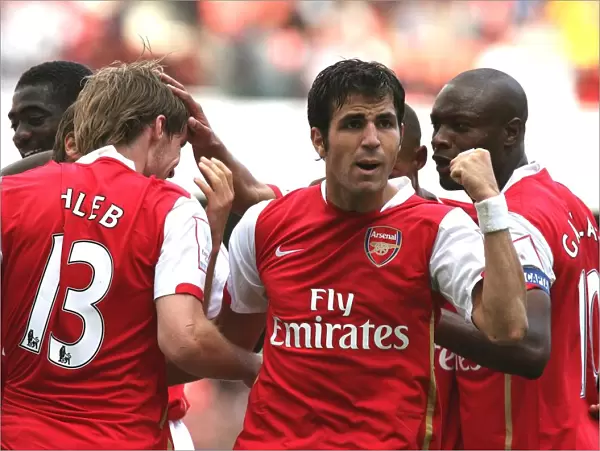 Cesc Fabregas celebrates Arsenals 1st goal scored by Alex Hleb