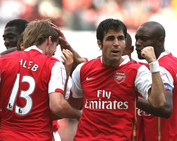 Cesc Fabregas celebrates Arsenals 1st goal scored by Alex Hleb