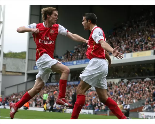 Robin van Persie celebrates scoring the Arsenal goal with Alex Hleb