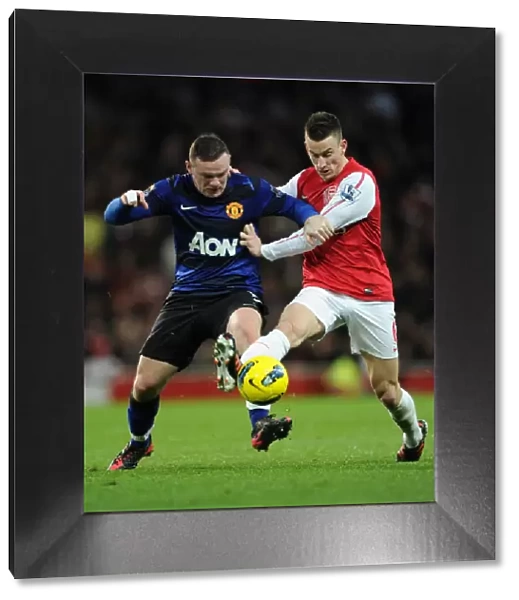 Intense Battle: Koscielny Tackles Rooney in Arsenal vs Manchester United
