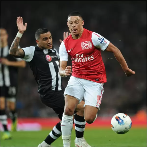 Arsenal's Alex Oxlade-Chamberlain Outmaneuvers Newcastle's Danny Simpson in Premier League Clash (Arsenal v Newcastle United, 2011-12)