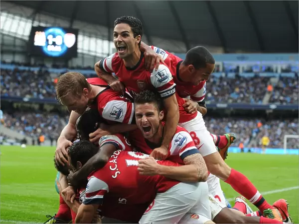 Arsenal's Unforgettable Moment: Koscielny's Goal Celebration with Team Mates Mertesacker, Gervinho, Cazorla, Arteta, and Walcott