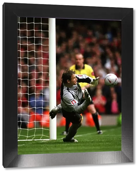 Arsenal goalkeeper Jens Lehmann prepares to save the 2nd Manchester United penalty taken by Paul Sch