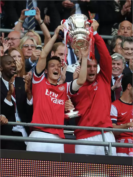 Arsenal FC: Ozil and Podolski Celebrate FA Cup Victory with the Trophy