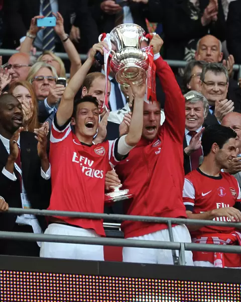 Arsenal FC: Ozil and Podolski Celebrate FA Cup Victory with the Trophy