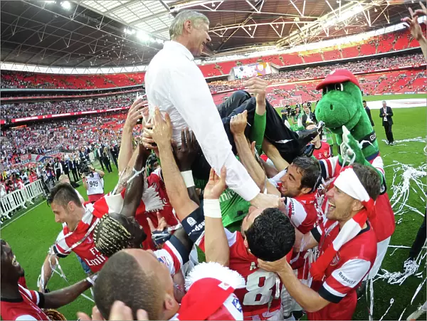Arsenal's FA Cup Triumph: Wenger Lifted High Amidst Jubilant Squad