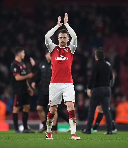 Aaron Ramsey Celebrates with Arsenal Fans after Arsenal v AC Milan Europa League Clash