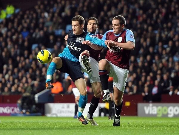 Aaron Ramsey Faces Off Against Carlos Cuellar and Richard Dunne in Intense Aston Villa vs. Arsenal Clash