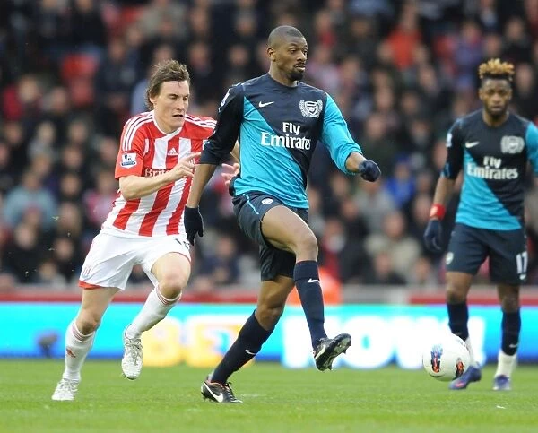 Abou Diaby Outmaneuvers Dean Whitehead: A Pivotal Moment from the 2011-12 Stoke City vs. Arsenal Match