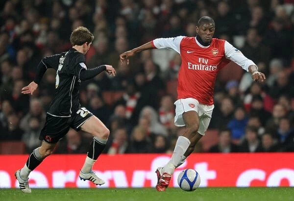 Abou Diaby and Thomas Carroll Clash in Arsenal's 5-0 FA Cup Victory over Leyton Orient