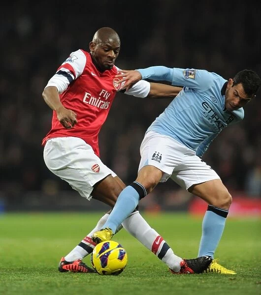 Abou Diaby vs. Carlos Tevez: Intense Tackle in Arsenal vs. Manchester City Premier League Clash (2012-13)