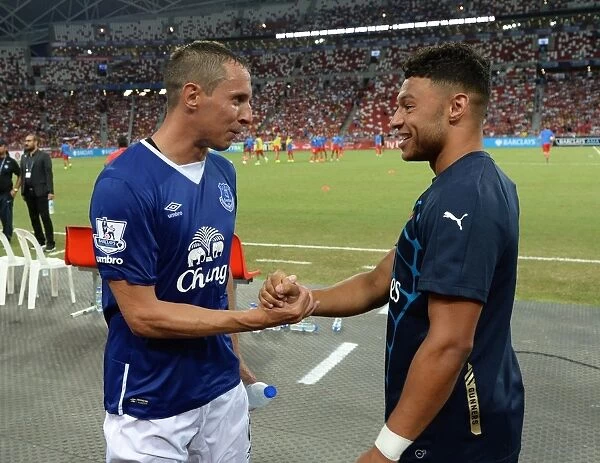 Alex Oxlade-Chamberlain and Phil Jagielka Engage in Pre-Match Chat (Arsenal v Singapore XI)