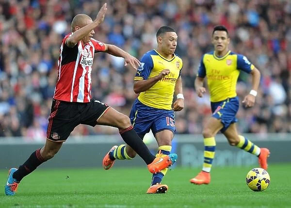 Alex Oxlade-Chamberlain Surges Past Wes Brown in Sunderland vs. Arsenal Premier League Clash
