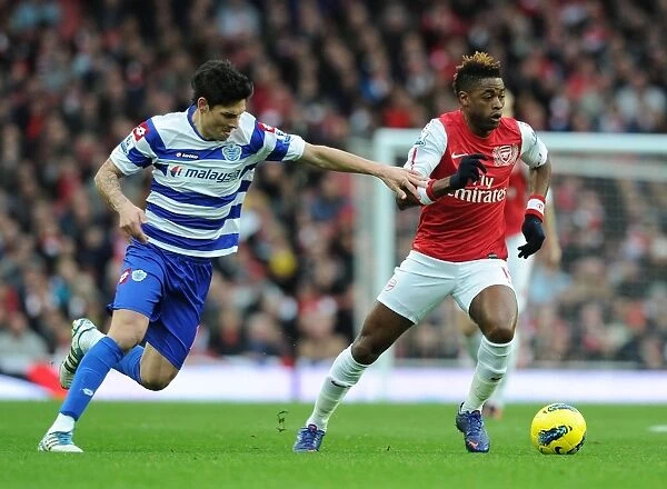 Alex Song Outmaneuvers Alejandro Faurlin in Arsenal's Victory over Queens Park Rangers