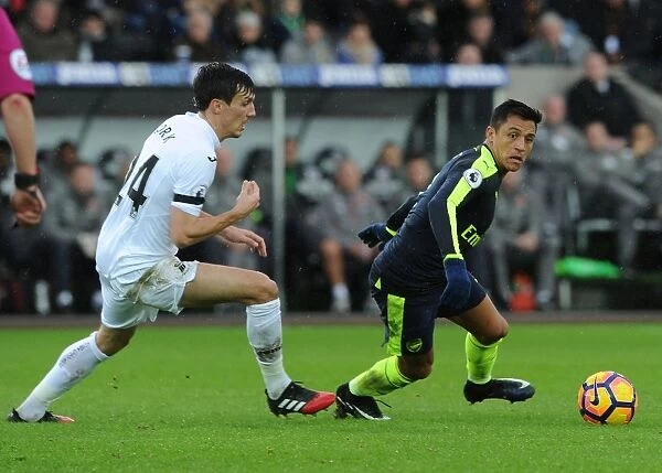 Alexis Sanchez vs Jack Cork: Intense Battle in Swansea City vs Arsenal Premier League Clash