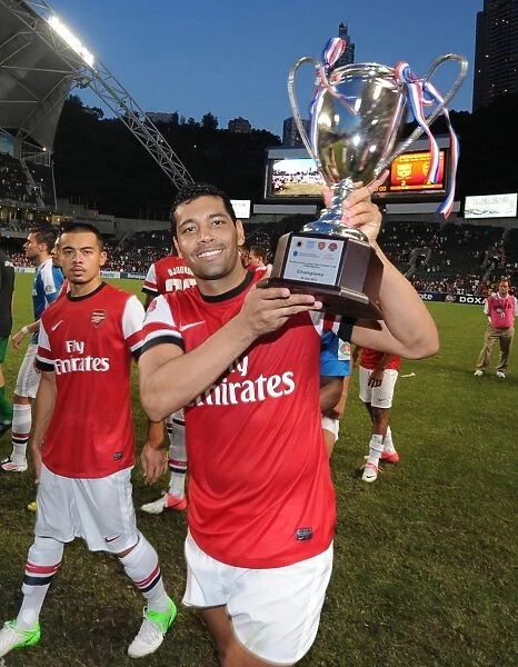 Andre Santos Celebrates with Arsenal's Pre-Season Trophy after Kitchee FC Victory, 2012