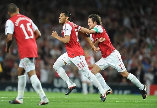 Andre Santos and Tomas Rosicky Celebrate Arsenal's Second Goal Against Olympiacos in the 2011-12 UEFA Champions League