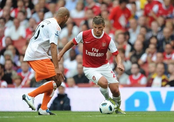 Andrey Arshavin (Arsenal) Alex Baptiste (Blackpool). Arsenal 6: 0 Blackpool