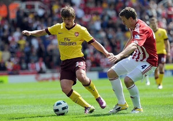 Andrey Arshavin (Arsenal) Robert Huth (Stoke). Stoke City 3: 1 Arsenal. Barclays Premier League