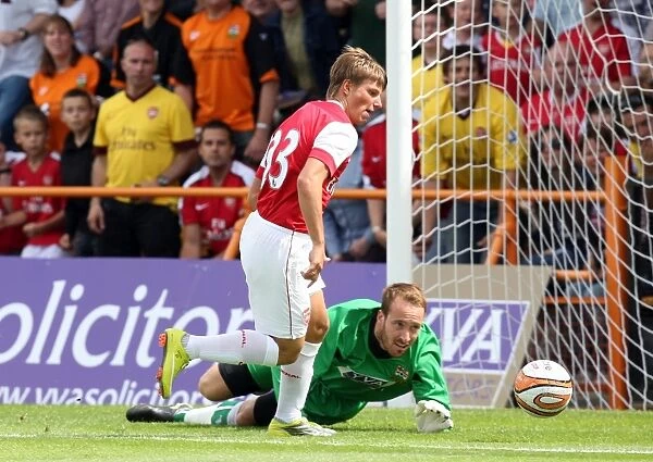 Andrey Arshavin rounds Jake Cole (Barnet) to scores Arsenals 1st goal
